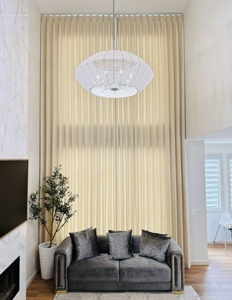 Curtains in entertainment room with high ceiling by Skyview Blinds and Shades 2