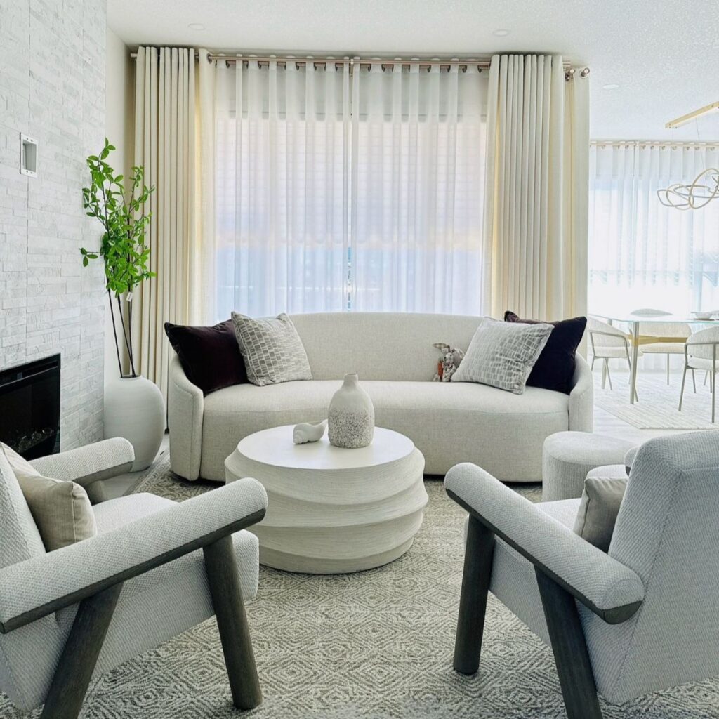 Curtains in living room with white sofa and chair by Skyview Blinds and Shades (square)
